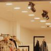 Stylish clothing store display featuring mannequins with trendy outfits and accessories.